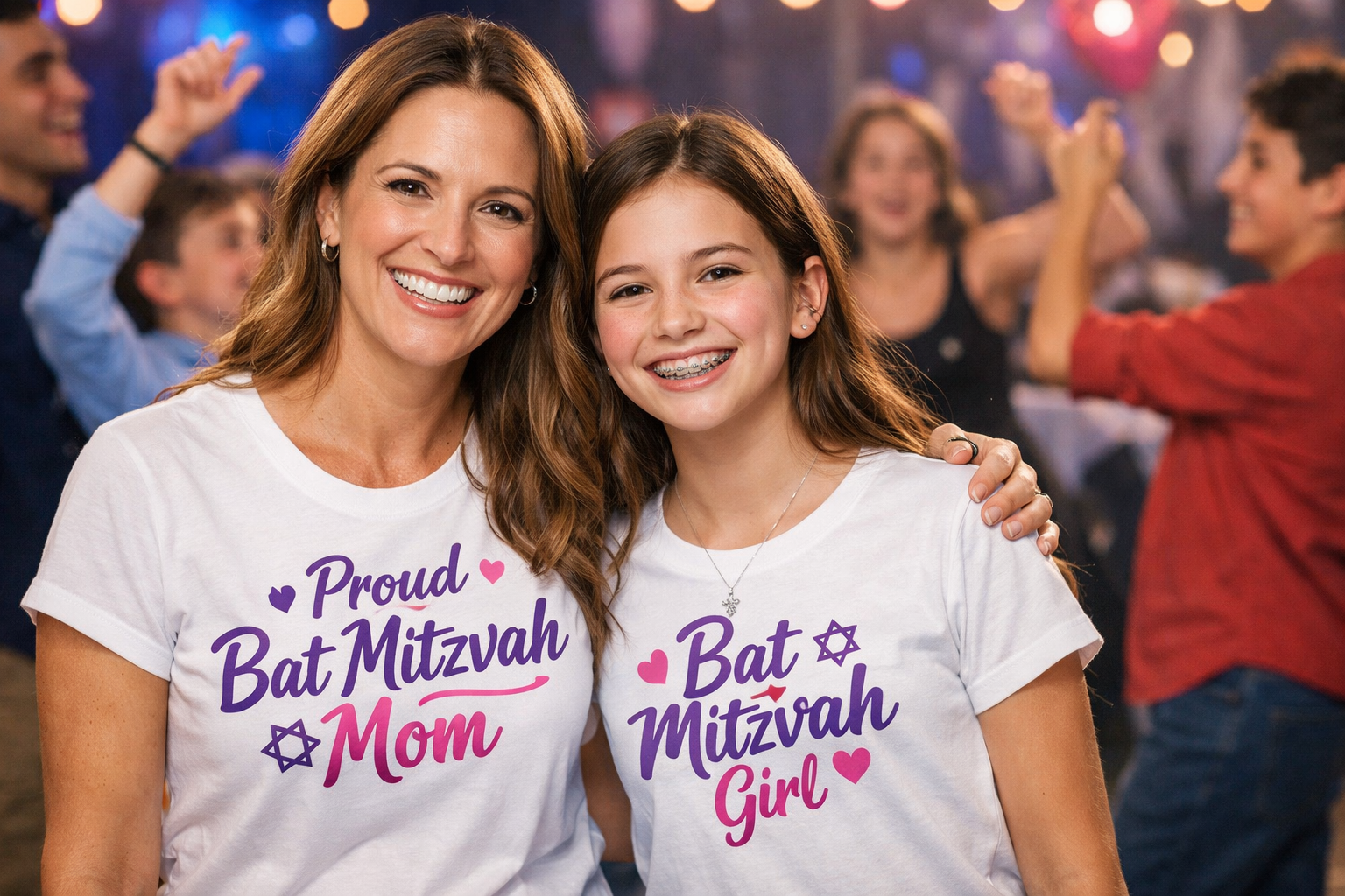 Mom and daughter wearing matching Bat Mitzvah shirts smiling together while kids dance at a Bat Mitzvah party